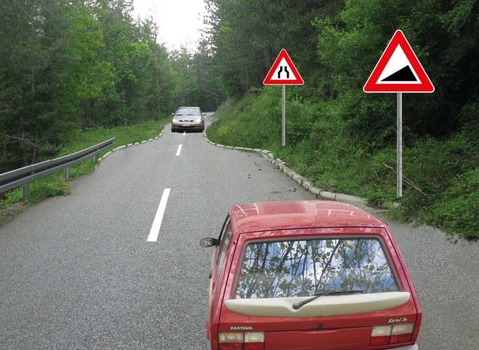 У ситуацији приказаној на слици, на делу пута који је саобраћајним знаком означен као опасан успон, односно као опасна низбрдица, на коме је мимоилажење возила немогуће због сужења пута са обе стране: